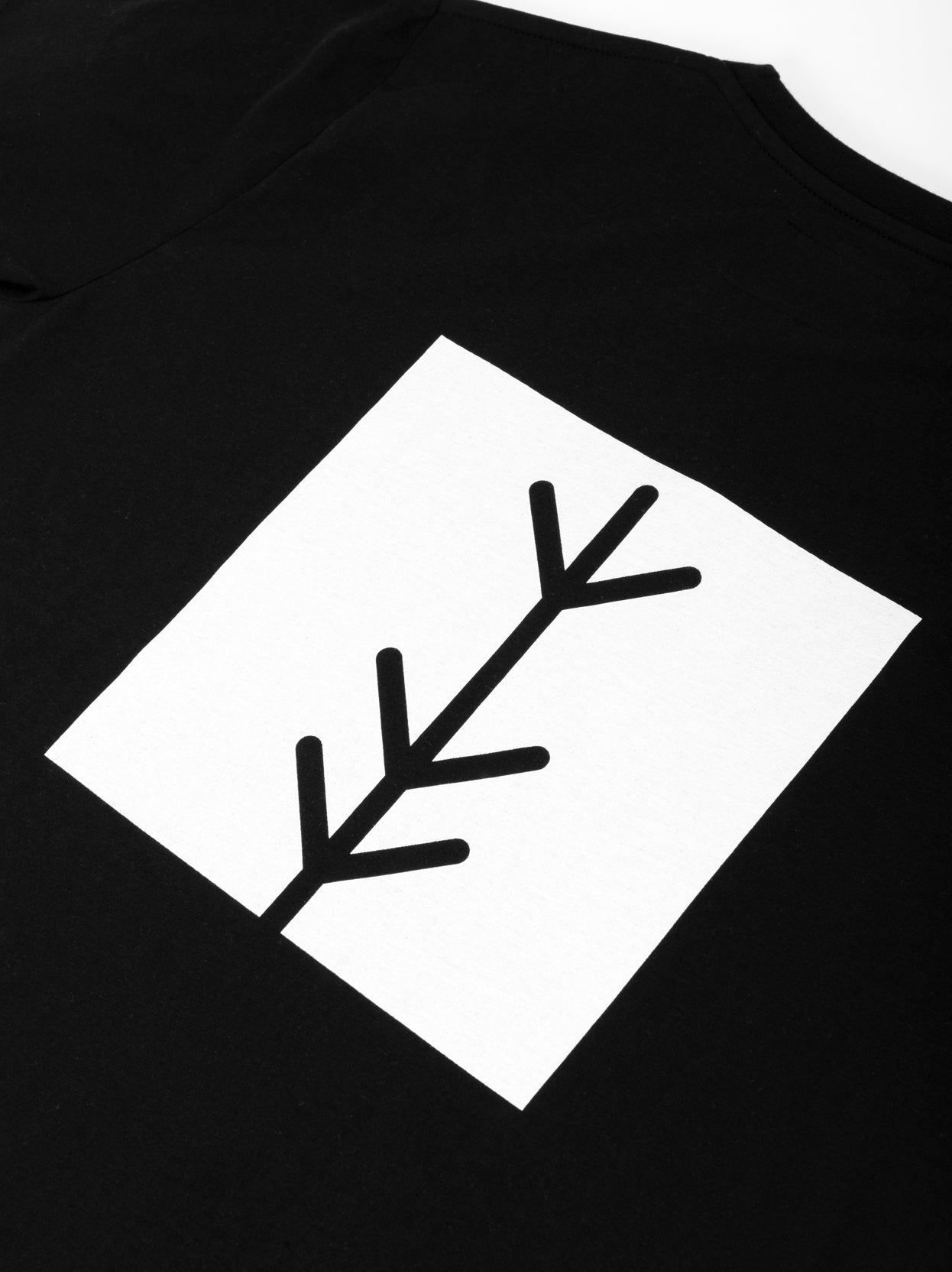Black Travel Tee logo