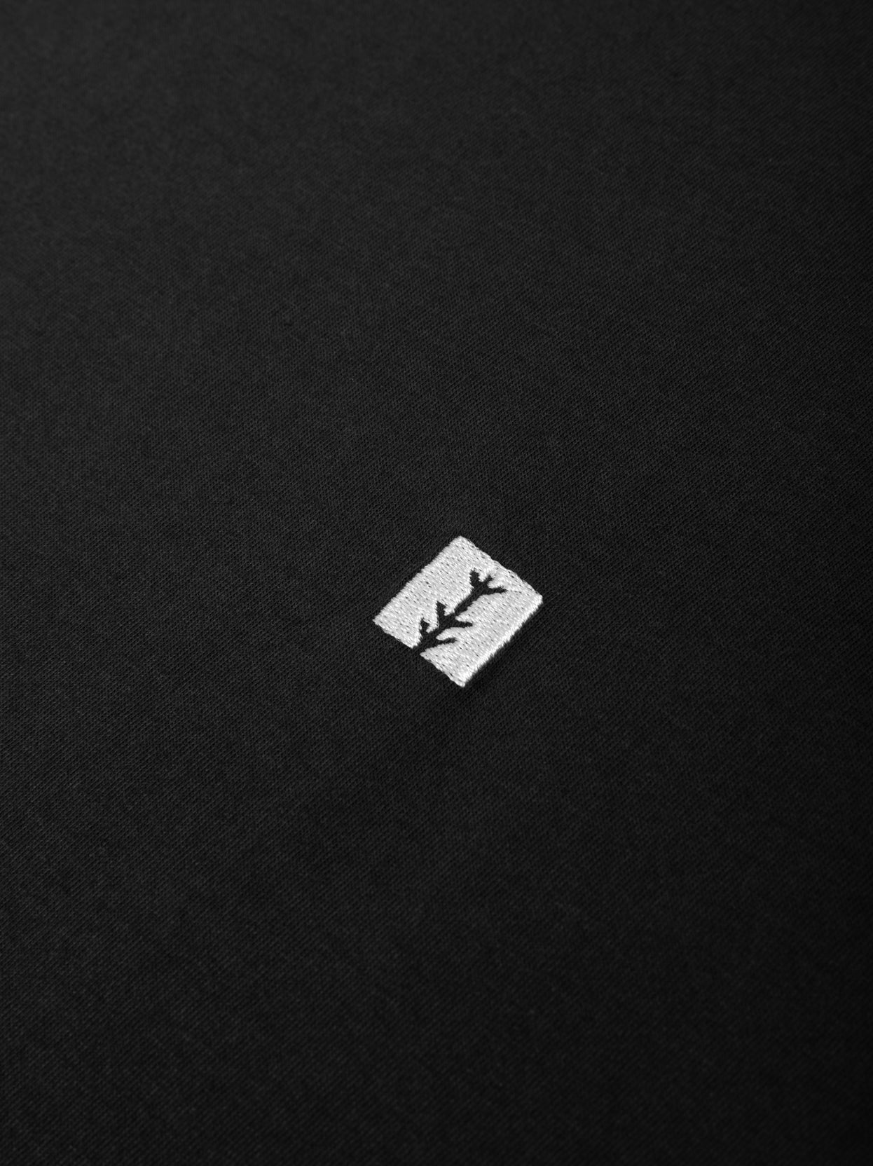 dark grey tree tee logo