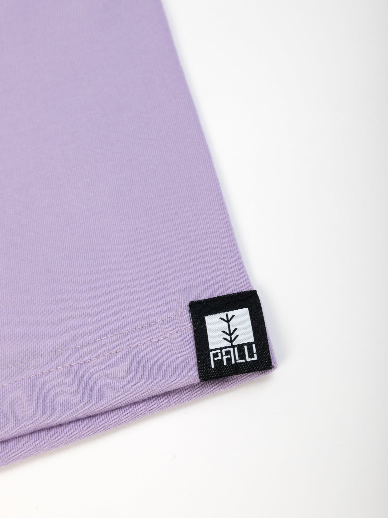 Lilac Travel Tee tag